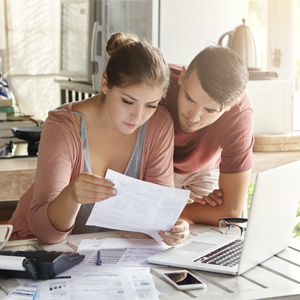 Married couple looking at finances