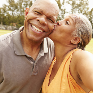 Wife kissing husband on cheek